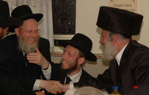 HaRav Osher Weiss (right), Rav of Ramot Gimmel greets HaRav Yisroel Gans (left), a Rosh HaYeshiva of Kol Torah at the hachtorah of son HaRav Yehuda Gans (center) , Rov of K'hal Adas Yeshurun—Jerusalem